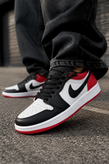 کتانی دخترانه نایک ایر جردن ۱ لو (Nike Air Jordan 1 Low) رنگ قرمز، مشکی و سفید